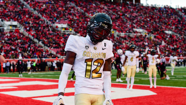 Nov 25, 2023; Salt Lake City, Utah, USA; Colorado Buffaloes athlete Travis Hunter (12) reacts after scoring a touchdown against the Utah Utes at Rice-Eccles Stadium.